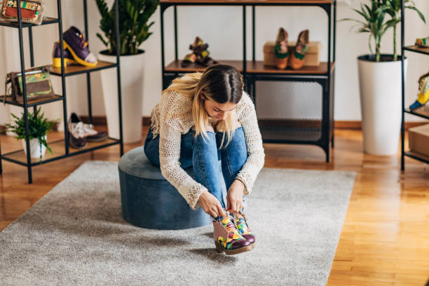 istock Woman trying on shoes 1316418525