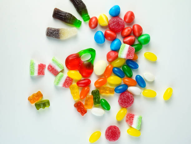 istock Many sweets and candies on a white background. Too much sugar concept 1316421788