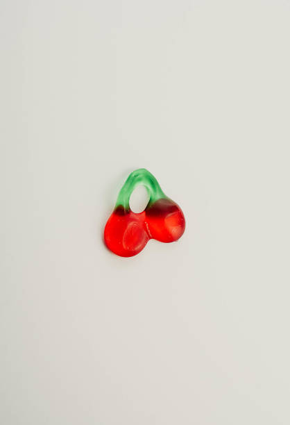 istock cherry flavored jelly bean on white background 1316421790