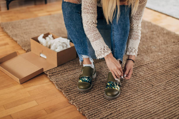 istock Woman trying on shoes 1316423051