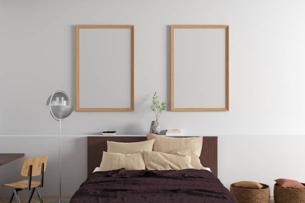 istock Two vertical  blank posters frames blank poster frame mock up on the white wall in interior of modern bedroom. 1316424246