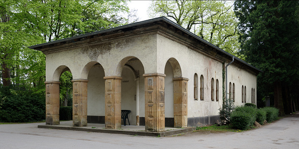 Cologne, Germany - May 03, 2021: The old mourning hall from 1880/81 in neo-Romanesque style at the Melaten cemetery
