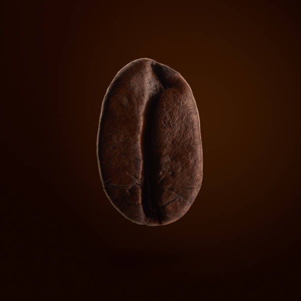 Single roasted coffee bean levitating in mid-air with a soft shadow under on orange background