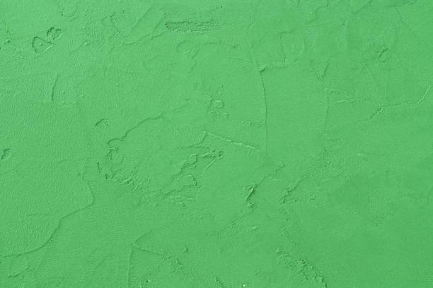 istock Green colored decorative plaster surface. Light green color concrete background. 1316428096