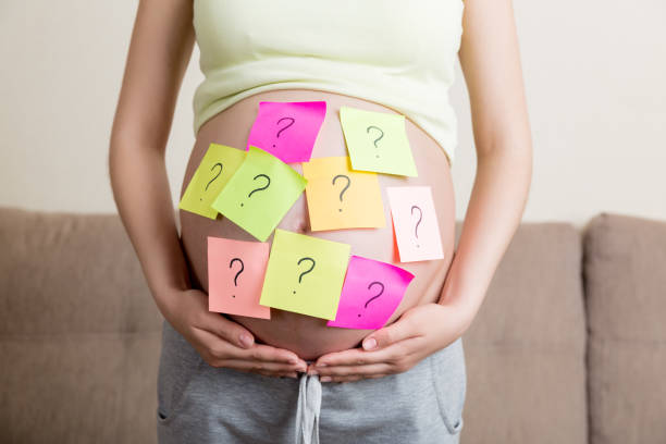 istock Pregnant woman belly with question mark. Pregnancy and thinking problem 1316432187