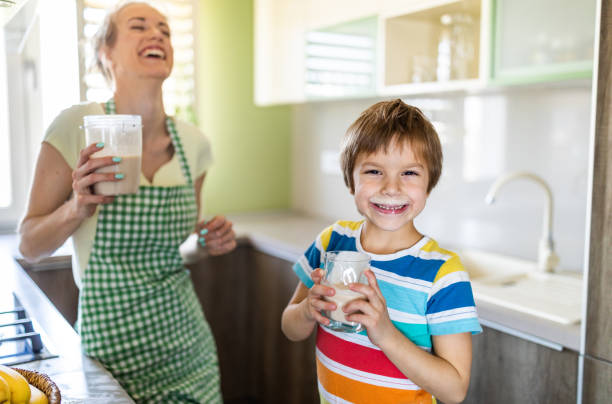 istock Mother and her little son drinking healthy smoothie 1316432742