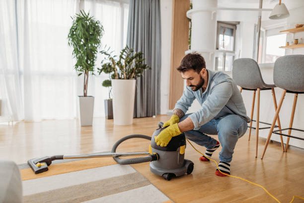 istock Man at home vacuum cleaning 1316433351