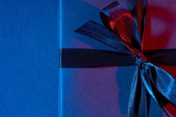 istock Blue red gift box close up on colorful background 1316435632