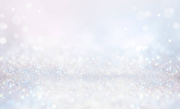 istock Glitter background in pastel delicate silver and white tones de-focused. 1316435643