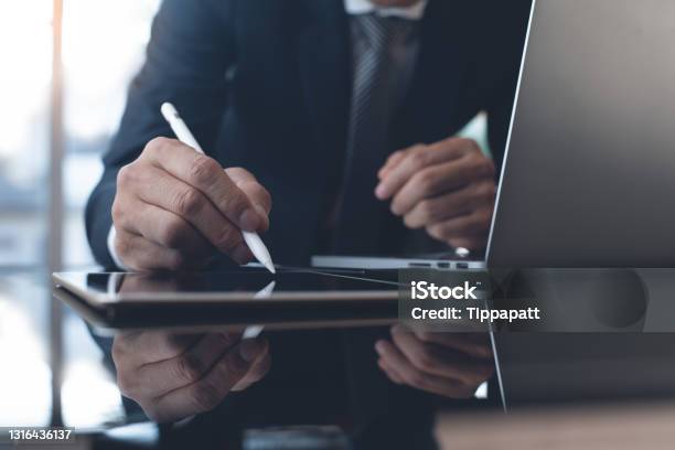 Businessman Working In Modern Office Stock Photo - Download Image Now - Electronic Signature, Contract, Digital Tablet