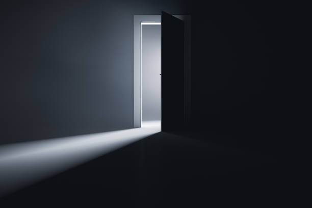 istock A slightly open door to a room with bright light. 1316436959