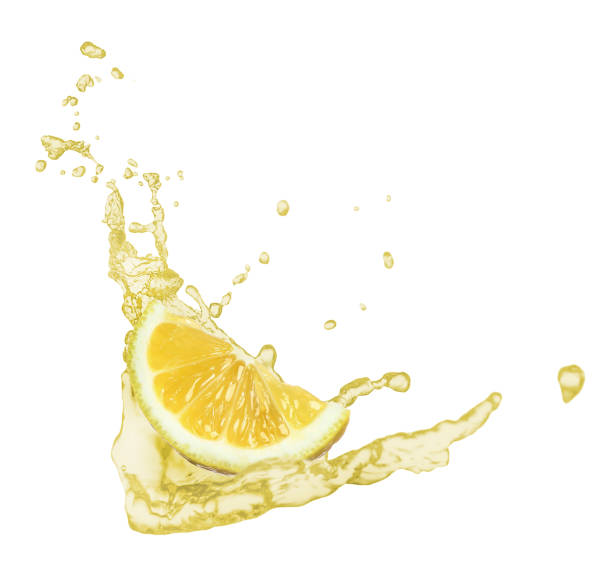 istock Lemon slice and splash of juice on white background 1316440148