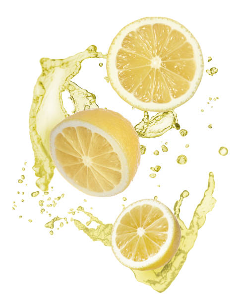 istock Lemon slices and splash of juice on white background 1316440267