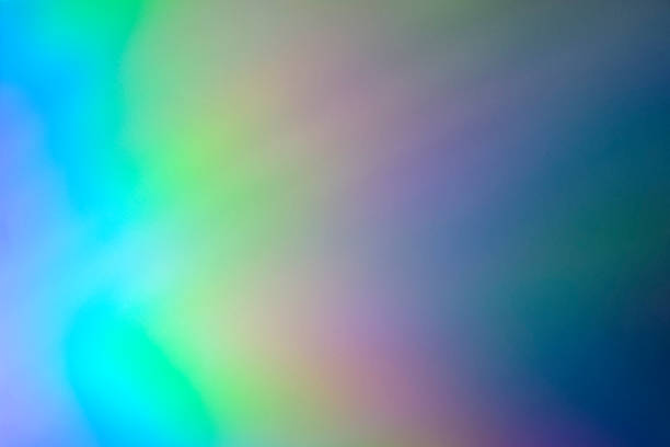 istock Blurred rainbow light refraction texture overlay effect for photo and mockups. Organic holographic flare on a white wall. Shadows for natural light effects 1316440359