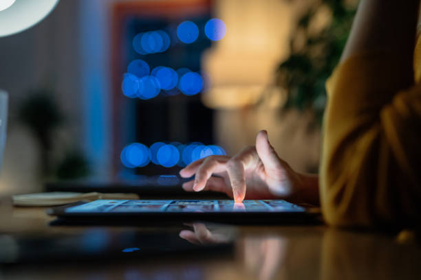 istock Woman touching digital tablet at table at home 1316440487