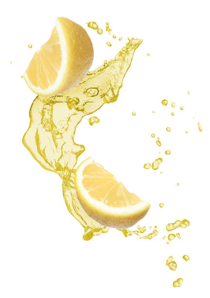 Lemon pieces and splash of juice on white background