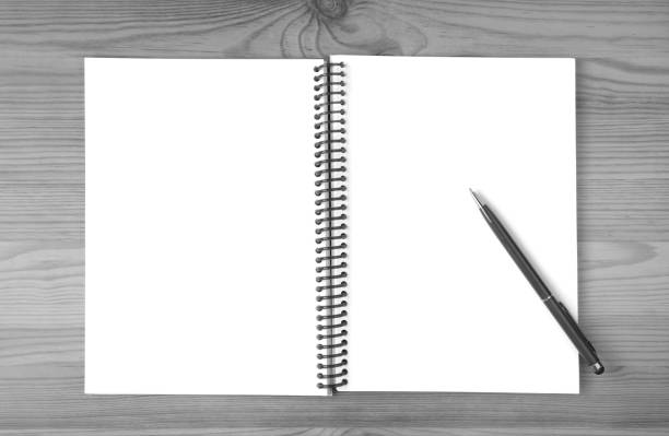 Blank Notebook and Pen Isolated on Wooden Table with Copy Space in Monochrome