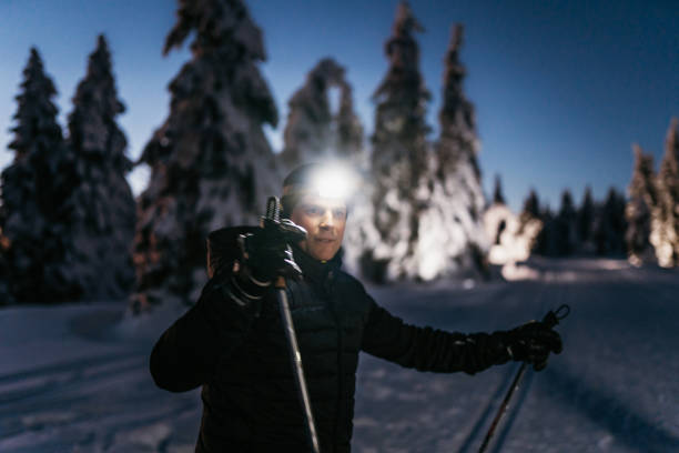 istock Man holding ski pole standing on snow 1316441855