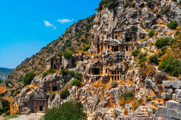 Ancient stone Myra Tombs in Demre in the Lycian region of Turkey on a sunny summer day stock photo