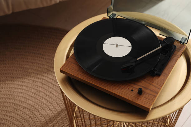 istock Stylish turntable with vinyl disc in room, above view 1316442790