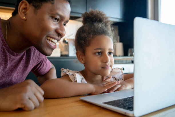 istock A father helping his daughter with homeschool. 1316445603
