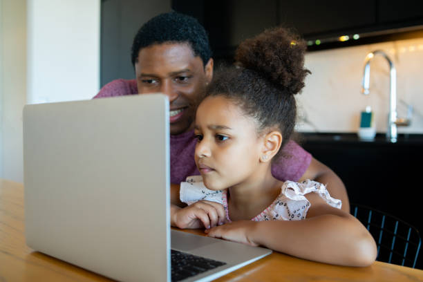 istock A father helping his daughter with homeschool. 1316445605