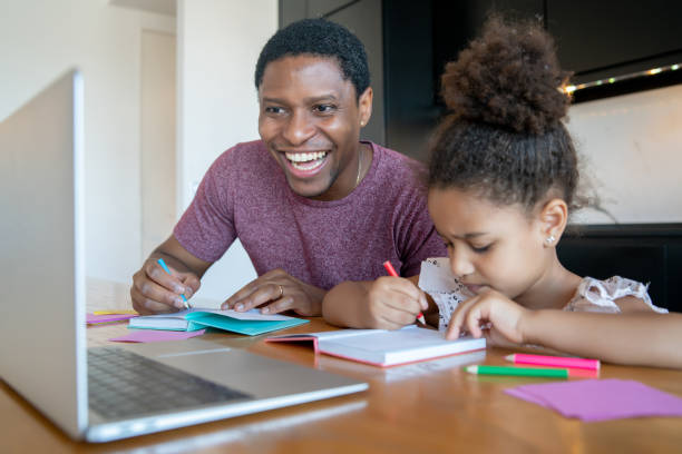 istock A father helping his daughter with homeschool. 1316445616