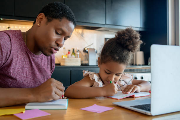 istock A father helping his daughter with homeschool. 1316445643