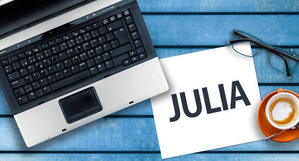 istock Word Julia on paper and laptop 1316448017