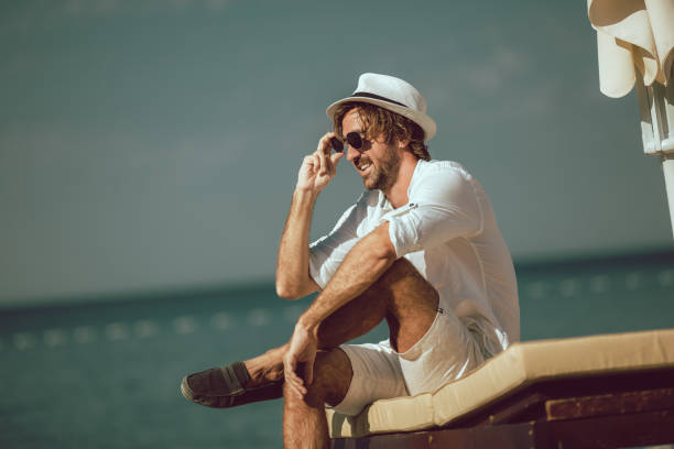 istock Young man relaxing at sea beach 1316449028
