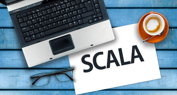 istock Word Scala on paper and laptop 1316449384