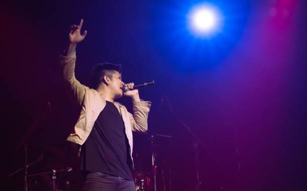 istock Asian male singer showing his performance on stage 1316450393