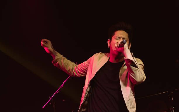 istock Asian male singer showing his performance on stage 1316450489