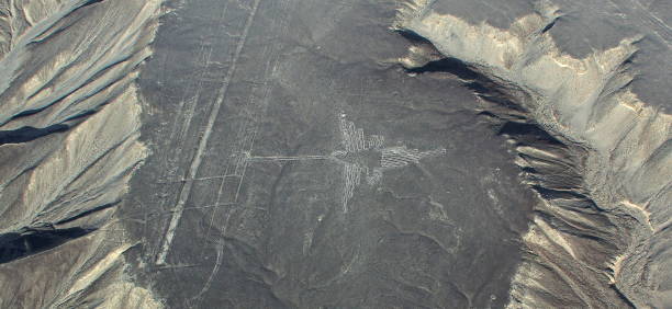 Nazca aerial view, with interesting sandy hill formations and Colibri geoglyphic in the center, Peru stock photo