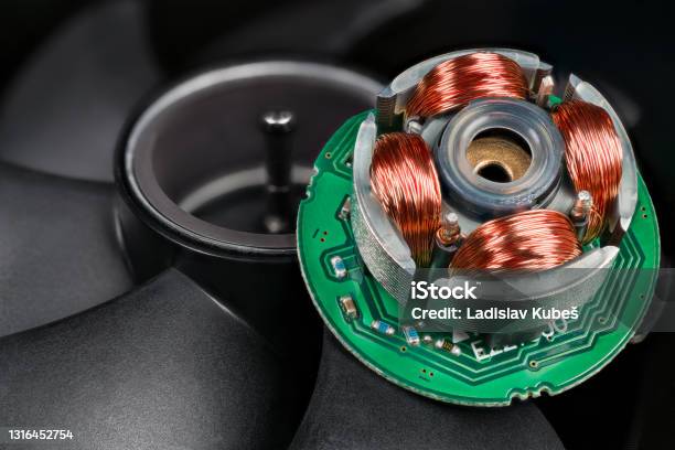 Closeup Of Inductors On Stator And Rotor With Permanent Magnet And Black Blades In Background Stock Photo - Download Image Now