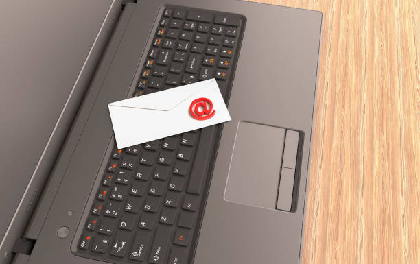 istock Email Concept With 'At' Symbol, Envelope and Laptop 1316455330