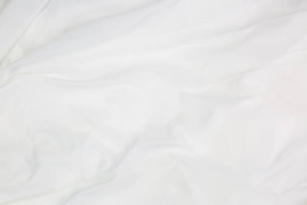 istock White cloth background abstract with soft waves,Closeup elegant crumpled of white silk fabric cloth background and texture. Luxury background design. 1316455452