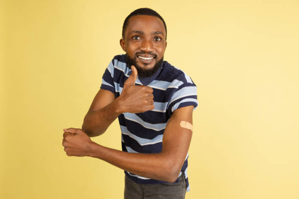 istock One African young man posing isolated over yellow studio background with copyspace for ad 1316458379