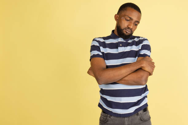 istock African man's portrait isolated over yellow studio background with copyspace for ad 1316458413