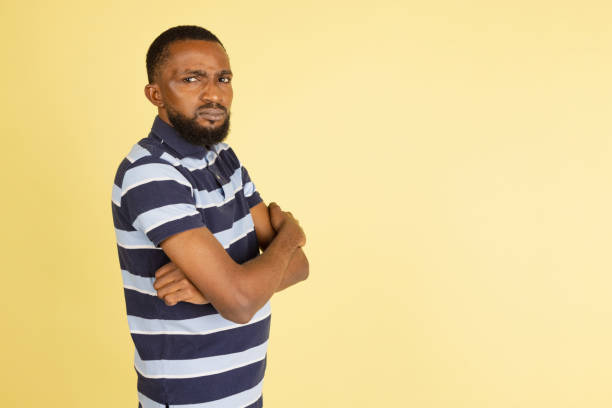 istock African man's portrait isolated over yellow studio background with copyspace for ad 1316458423