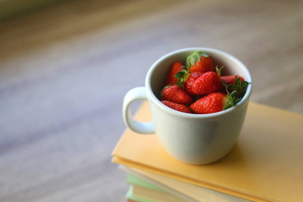 istock Strawberries and Books 1316460378