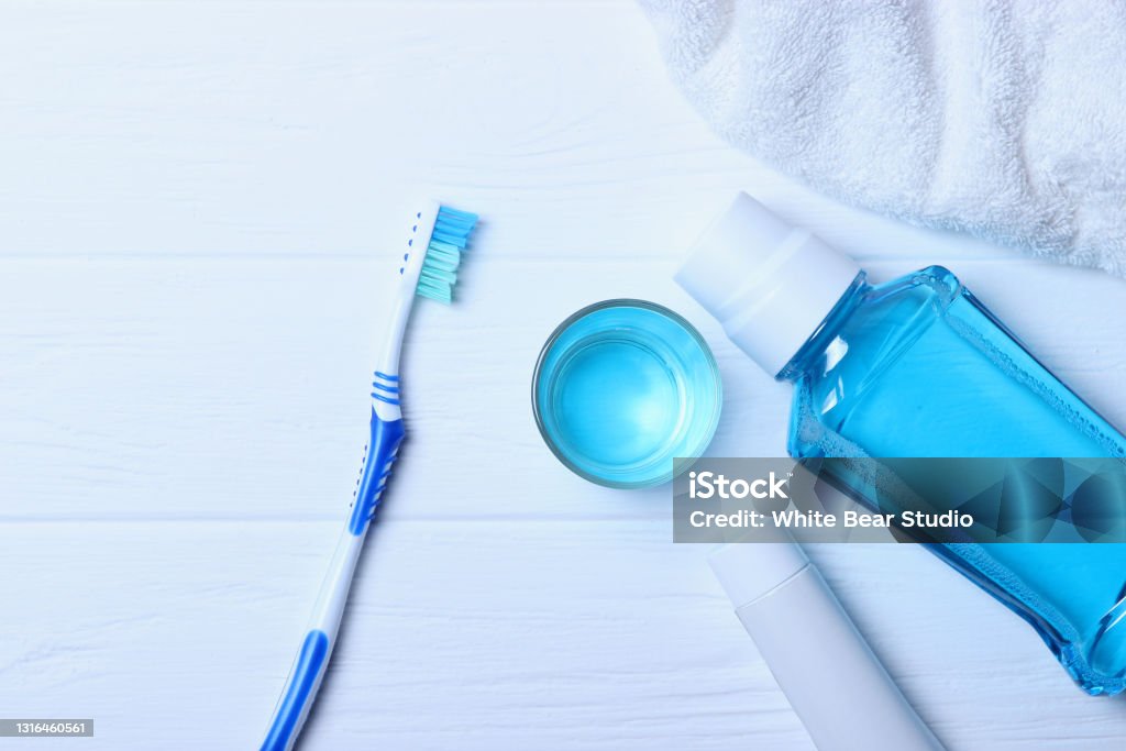 Flat composition for oral care and place for text on a light background. Flat composition for oral care and place for text on a light background. Dental hygiene. High quality photo Mouthwash Stock Photo