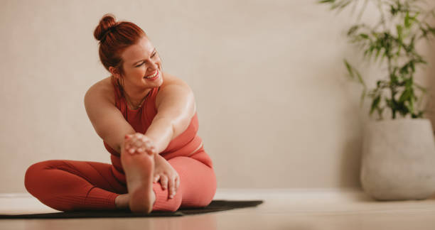 istock Smiling woman doing stretching leg workout 1316460768