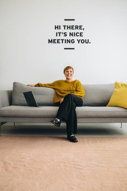 istock Happy female entrepreneur sitting at lobby 1316462299