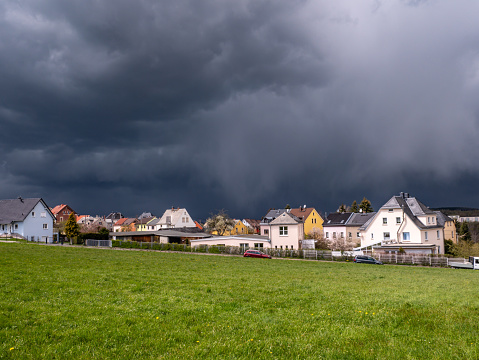 Storm clouds over a village
