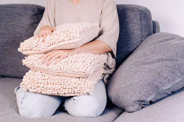 istock Knits made from thick soft yarn. Soft knitted cushions made of thick yarn. 1316465292