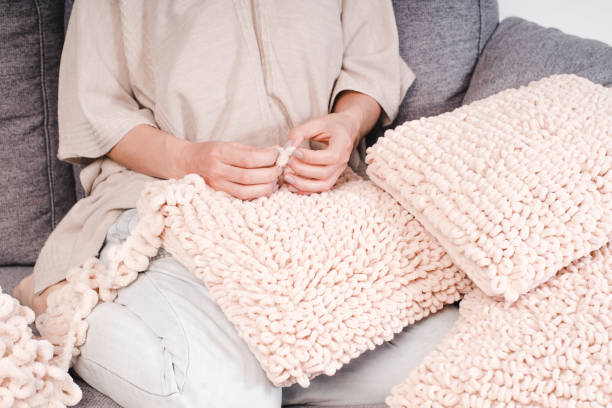 istock Knits made from thick soft yarn. Soft knitted cushions made of thick yarn. 1316465406