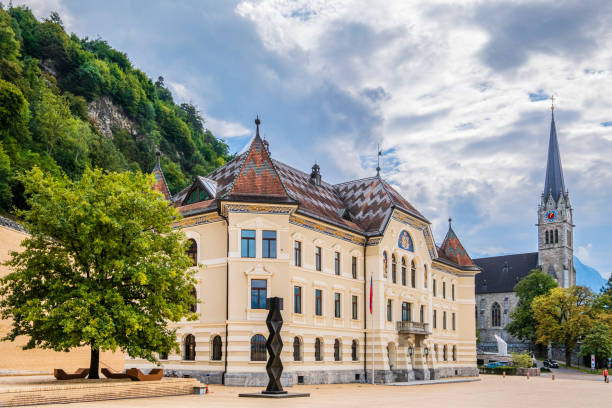 The Government building of Vaduz, dating to the early 1900s, is centrally located in Peter-Kaiser-Platz square, the government district of the capital of Liechtenstein. Cathedral in background.