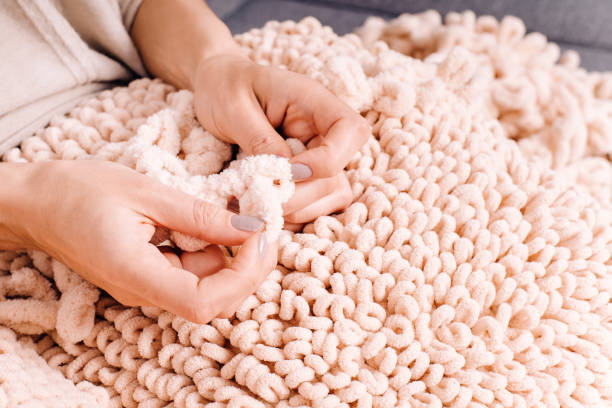istock Knits made from thick soft yarn. Soft knitted cushions made of thick yarn. 1316466154
