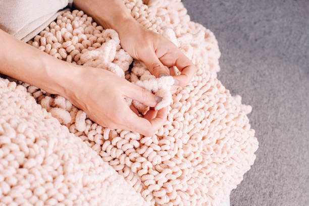 istock Knits made from thick soft yarn. Soft knitted cushions made of thick yarn. 1316466158